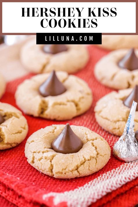 Hershey Kiss cookies are soft, chewy peanut butter cookies topped with a tasty chocolate kiss! It's a best-loved simple cookie recipe. #peanutbuttercookies #kisscookies #cookies #peanutbutter #hersheyskiss Peanut Butter Hershey Kiss Cookies, Peanut Butter Kiss Cookies Recipe, Bisquick Cookies, Simple Cookie Recipe, Hershey Recipes, Kiss Cookie Recipe, Chocolate Kiss Cookies, Peanut Butter Blossoms Recipe, Hershey Kiss Cookies