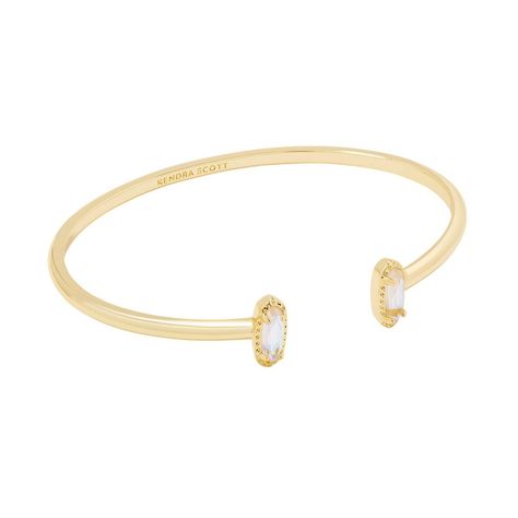 Looking for a pop of sparkle to add to your wrist stack? Meet the Emma Cuff Bracelet, aka your new style essential. Two elongated stones bookend this adjustable metal cuff you can fit to your wrist perfectly. On-trend and oh-so-cute, you'll style this bracelet time and time again. Designer, founder, and philanthropist Kendra Scott started her company in 2002, just three months after her first son was born. Her commitment to innovation, quality, customer service, and detail has taken her from a s Kendra Scott Bangle, Old Money Bracelet Stack, Kendra Scott Cuff Bracelet, Kendra Scott Bracelet Stack, Wrist Stack, Kendra Scott Bracelet, Gold Cuff Bracelet, Brass Cuff Bracelet, Preppy Jewelry