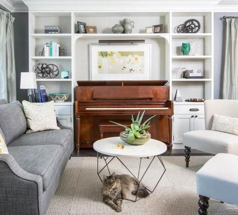 Between bookcases and shelving, there is often space for a small piano, even in a house of limited square footage. This mid century console is a perfect fit for its 50’s styled furniture and adds a nice color contrast to the pale hues. Piano Room Design, Piano Room Decor, Piano Living Rooms, Piano Decor, Living Room Layout, Small Living Room Design, Piano Room, Traditional Interior Design, Living Room Shelves