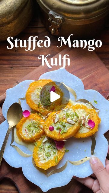 Rashmi Vaishnav on Instagram: "Stuffed Mango Kulfi

Recently i tried stuffed mango kulfi & it was insane! Try it before the mango season lasts. 

Scoop out mango seed from mango in order to make a cavity. 
For mango filling, boil full fat milk with sugar, chopped cardamom, and saffron until it is reduced by 50 to 60 percent. You can use condensed milk too instead of sugar. Let it cool. 
Fill this rabdi in mango cavity & cover it with back with chopped tip of mango. 
Freeze for around 6-8 hours in fridge. 
Peel off the mango peel & slice it. 
Garnish with dry fruits, saffron & rose petals.
Try it to believe how delicious it tastes. 
#pinkiyakya #ourcultureourpride #stuffedmangokulfi @pinterestindia @googleindia @ndtv_food @incredibleindia" Mango Freeze, Mango Filling, Mango Kulfi, Mango Seed, Dry Fruits, Indian Recipes, Condensed Milk, Dried Fruit, Cavities