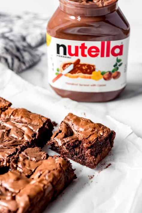 These rich, deeply chocolatey Nutella Brownies are a home run dessert for anybody who loves the indulgent chocolate hazelnut spread. Not only is the brownie batter made with Nutella, but then more of it is dropped on top and swirled in for pockets of concentrated Nutella goodness! #brownies #nutella #recipe #best #chocolate #hazelnut #swirled #homemade Pecan Pie Cake Recipe, Pie Cake Recipe, Nutella Recipes Brownies, Pecan Pie Bar, Chocolate Walnut Fudge, Pecan Pie Cake, Nutella Recipes Easy, Ultimate Brownies, Resep Brownies