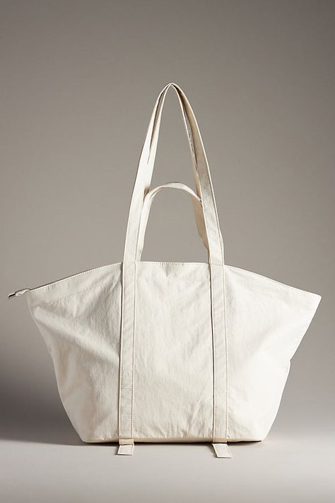 Nylon; polyester lining Features straps for yoga mat on base One inner slip pocket One inner zip pocket Zipper styling Imported | The Dasha Lace-Up Trapeze Tote by Anthropologie in White, Women's, Polyester/Nylon