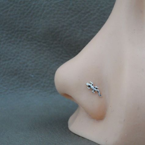 "A tiny Lizard Sterling Silver nose Stud. This nose stud is made of sterling silver so it is great for those with sensitive skin. The Lizard measures 7mm x 3mm The stud is made of 23g wire and has your choice of ball end or straight end. Ball End=6mm length Straight End= 9mm length. The straight end is bend to fit, it can be bent into an \"L\" shape. This listing is for one nose stud ( 1 piece)" Nose Piercing Cute Studs, Nose Piercing Stud Jewelry, Cute Nose Jewelry, Cute Nose Rings Studs, Nose Piercing Jewelry Studs, Aesthetic Nose Piercing Stud, Cute Piercings Nose, Cool Nose Rings, Nose Piercing Stud Aesthetic