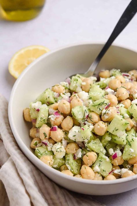 Chickpea Cucumber Feta Salad - Real Greek Recipes Lemony Chickpea Feta Salad, Greek Yogurt Chickpea Salad, Garbanzo Cucumber Salad, Afternoon Snack Ideas For Adults, Tzatziki Cucumber Salad, Chickpea And Cucumber Salad, Chickpea Feta Cucumber Salad, Cucumber And Feta Salad, Quick And Easy Potluck Recipes