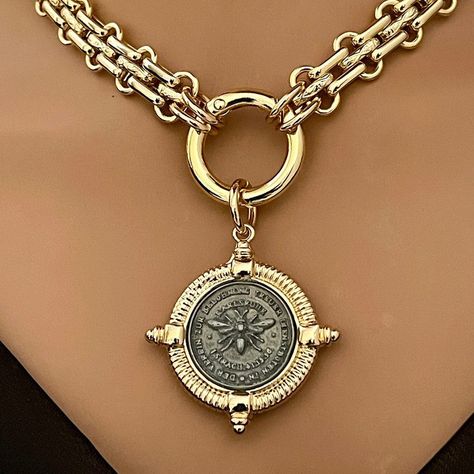 Stunning chunky, gold textured chain with a replica French Bee pendant in a 4 spiked bezel. The spring ring clasp is easy to open and close. A truly beautiful Art Deco-inspired piece. Choice of 3 pendants #1 All gold #2. Gunmetal coin/Gold Bezel #3 Gold coin/GunmetalBezel Choose your preference from the drop-down menu to order. Mixed metal colors and materials have become a big fashion statement. The shiny gold chain necklace is gold electroplated brass and is 11mm wide, chunky and thick. Great weight and sits beautifully around the neck. Lead safe and nickel free. - Coin size: 21mm - Coin and Bezel: 38mm Pendants: Plated Zinc Alloy. Tips to keep your jewelry looking good. 1) Keep jewelry away from water and chemicals. 2) Remove during physical activities. 3) Store separately in a soft pou Tusk Necklace, Grandmother Necklace, Mens Sterling Silver Necklace, Skeleton Key Necklace, Padlock Necklace, Bar Pendant Necklace, Sunflower Necklace, Golden Necklace, Leather Corded Necklace