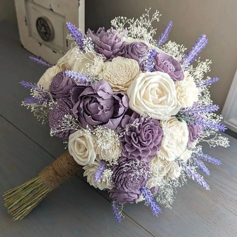 "Please Read Entire Description Before Purchase Bouquet with sola wood flowers in ivory and lilac accents, with faux lavender and baby's breath. Flower styles can and will vary based on current inventory levels and to keep orders unique, so they are not exact duplicates. Please include your choice of stem wrap and color (color of ribbon, white or ivory lace, or twine) in the notes section. Size pictured is an extra large (approximately 10\" in diameter). First bride is holding an extra extra lar Bouquet With Lavender, Lavender Wedding Bouquet, Lavender Wedding Theme, Tangled Wedding, Purple Flower Bouquet, Lilac Bouquet, Purple Bridal Bouquet, Wood Flower Bouquet, Purple Wedding Theme