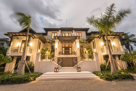 This luxury custom home is a British West Indies style architecture inspired by the Cove Resort in Atlantis. Tropical design overlooking Sarasota Bay on Siesta Key, Florida. #britishwestindies #waterfronthome #outdoorliving #luxuryhome #customhomebuilder #sarasota #siestakey West Indies House Exterior, Key West Style Homes Exterior, British West Indies Architecture, West Indies House, West Indies Architecture, West Indies Home, Key West Style Homes, British West Indies Style, Beach Dream House