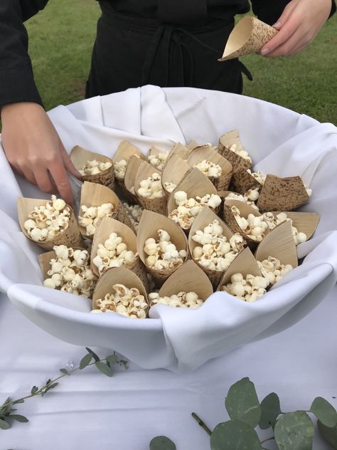 Tempt your wedding guests with popcorn to enjoy while they wait for you to come down the aisle.  #wedding #weddingceremony #popcorn #weddingdetails Popcorn Wedding Ceremony, Wedding Table Snacks Receptions, Pre Ceremony Snacks, Popcorn At Wedding, Savory Wedding Snacks, Cheap Cocktail Hour Food, Wedding Ceremony Snacks, Wedding Snacks Ideas, Wedding Snacks Appetizers