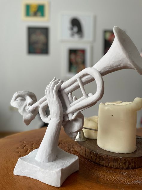 Handmade home decor Musical musician Sculpture Materials: polyester-marble dust Height: 25 centimeters- 9.84 INCHES Width: 32 centimeters - 12.50 INCHES Color : White Hand-Painted by acrylic paint // Durable Polyester Body Sizes // Width: 12.50 inches 32 cm Height: 9.84 inches 25 cm Modern Trumpet Artist Sculpture This Roman Bust can entirely change the room's ambience, atmosphere. This bust statue collection can be named as a classic statue and modern bust decor and it contributes a lot to your Bust Decor, Sculpture Materials, In Home Library, Classic Statue, Roman Bust, Music Sculpture, Artist Sculpture, Roman Busts, Sculpture Design