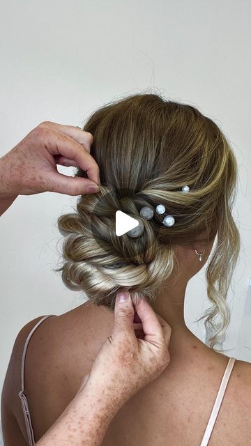 HANNAH TAYLOR on Instagram: "BRIDESMAID UPDO TUTORIAL ❤️ Using @cliphairlimited hair extensions just to add a little fullness to the bun, as you can see here I just took 1 row of extensions and folded it and attached to the ponytail, this will be really comfy and secure, and won’t affect anything when your pinning the hair in position. SAVE to go back to and please leave a comment if you’re feeling nice it’s always appreciated ❤️ . . . #updotutorial #lowupdo #hairtutorial #hairinspo #haireducation" Wedding Hair Medium Length Tutorial, Updo Bridesmaid Hair Ponytail, Diy Medium Hair Updos, Soft Updo Hairstyles Tutorial, Updos Bridesmaid Hair, Low Ponytail Wedding Hair Tutorial, Loose Bun Updo Tutorial, Twisted Low Bun Tutorial, Low Bun Updo Wedding Tutorial