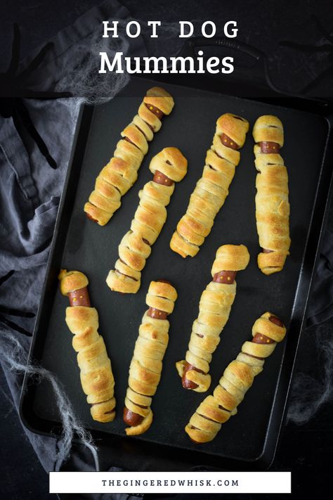 Kids can make these adorable mummy dogs themselves. Made with your favorite hot dogs and crescent rolls, these are a great meal to serve before Trick-or-Treating! Mummy Pigs In A Blanket Crescent Rolls, Hot Dog Mummies Crescent Rolls, Hotdogs In Crescent Rolls, Mummy Hotdogs Crescent Rolls, Crescent Wrapped Hot Dogs, Mummy Hot Dogs Crescent Rolls, Crescent Roll Hot Dogs, Mummy Hot Dogs Recipe, Halloween Mummy Hot Dogs