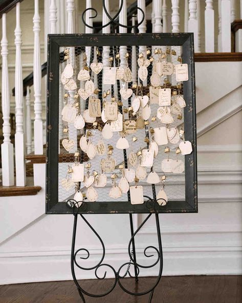 Unique Wedding Guest Book Ideas That Aren't Actually Books | Martha Stewart Weddings - In honor of her husband's heritage (he's from France), this bride thought to use love locks instead of a traditional guest book. Celebrants sealed their notes to this display. #guestbookideas #uniqueweddingideas #weddingguestbook Graduation Guest Signature Ideas, 80th Birthday Party Guest Book Ideas, Wedding Table Guest Book, 50th Wedding Anniversary Guest Book Ideas, Birthday Guest Sign In Ideas, Wedding Guests Sign In Ideas, Guest Book Ideas For Small Wedding, Guestbooks Ideas For Wedding Alternative, Unusual Wedding Guest Book Ideas