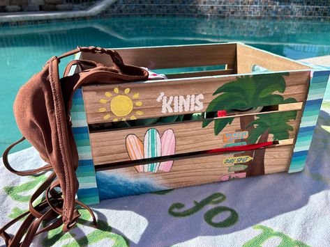 This bikini basket is hand painted, which makes each one unique and special in its own way! Each side has a different design so it makes for cute summer decoration! This basket is spacious and can hold several bathing suits. Perfect for the summer!☀️🌊🏖 (This product comes with the hand painted basket ONLY, does NOT include the bathing suits) Beach Gift Basket, Bestie Ideas, Surfer Aesthetic, Wood Bin, Summer Diy Projects, Painted Baskets, Beach Basket, Makeover Bedroom, Beach Gifts