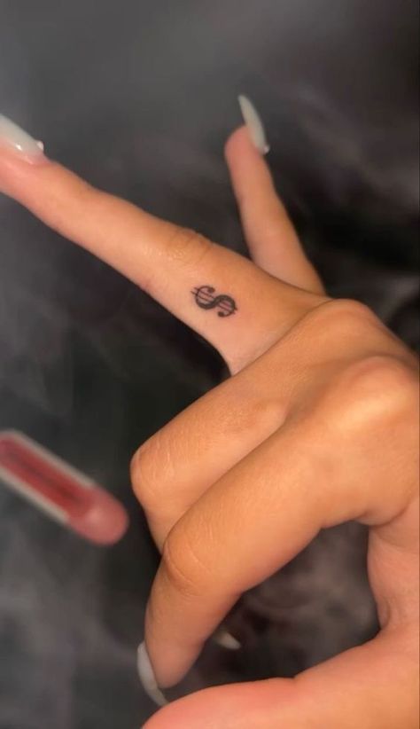 20 Dollar Tattoo Ideas, Dollar Sign Tattoo On Finger, Small Money Tattoo, Side Of Face Tattoo, Tattoo Ideas Female Baddie, Middle Finger Tattoo, Dollar Sign Tattoo, Pinky Tattoo, Inside Finger Tattoos