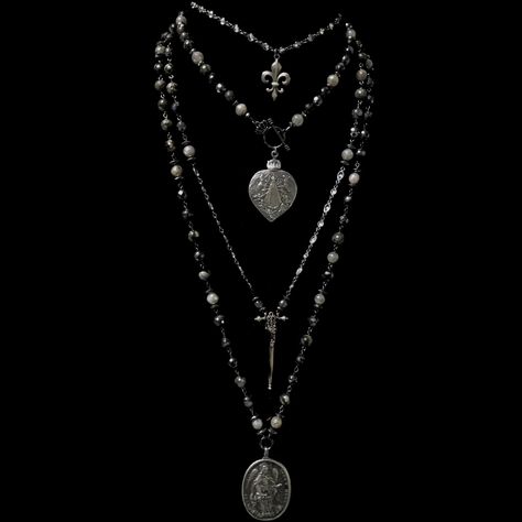 The Lujan Choker features an intricately carved Our Lady of Lujan medal within a flaming Sacred Heart made of Sterling Silver. She's surrounded by Angels, with two of them raising a crown of flowers above her. Pilgrims worldwide travel to see Her and have received special graces, favors and miracles. The gunmetal linked chain is offered in 17" or 22" based on your preference. If you need a longer or shorter size we can make one for you. It's a very special necklace because of the rarity of the m Statement Necklace Long, Silver Gothic Jewelry, Vamp Necklace, Gothic Locket, Wearing Crystals, Grunge Necklaces, Surrounded By Angels, Gunmetal Jewelry, Goth Jewellery