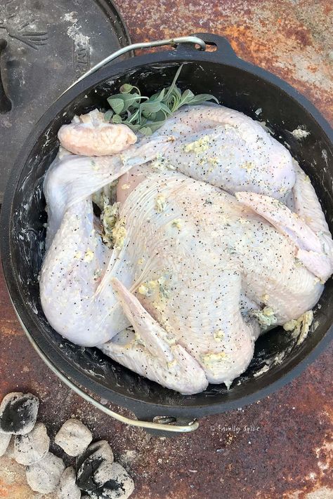 This Dutch Oven Roast Turkey is smothered in garlic sage butter and will turn your outdoor Thanksgiving into a fragrant traditional feast. It can be cooked on the campfire or grill or even indoors in a regular oven. #dutchoven #camping #camprecipes Turkey Dutch Oven Recipes, Turkey In Dutch Oven, Dutch Oven Turkey Thanksgiving, Dutch Oven Roast, Dutch Oven Turkey, Roast In Dutch Oven, Oven Turkey, Turkey Roasting, Turkey Chops