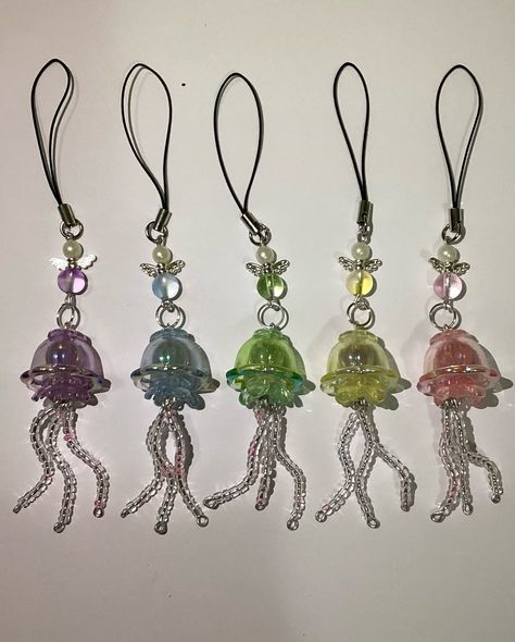 • jellyfish keychains🪼🎐༄.° 𓆝 ⋆｡𖦹°‧🫧 🪼🎐💜~20 dirhams 🪼🎐🩵~20 dirhams 🪼🎐💚~20 dirhams 🪼🎐💛~20 dirhams 🪼🎐🩷~20 dirhams Bead Jellyfish, Diy Keychain Ideas, Jellyfish Earrings, Diy Keychains, Keychain Ideas, Bead Charms Diy, Phone Charms, Handmade Jewelry Tutorials, Earring Ideas