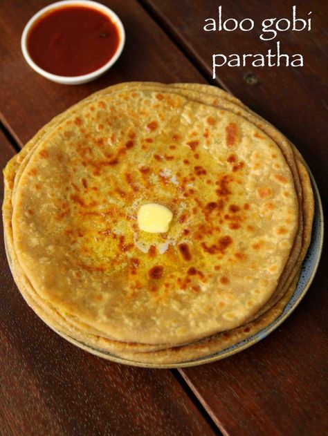 aloo gobi paratha recipe | aloo gobi ke parathe | alu gobi paratha with step by step photo and video recipe. paratha recipes are very common and are typically prepared with a key vegetable stuffing. however in this recipe the stuffing is prepared with fusion of 2 popular paratha stuffing’s. these paratha’s are very filling and is an ideal lunch box or tiffin box recipes relished with spicy pickle and cup of yogurt. Gobi Ke Parathe, Alu Gobi, Gobi Paratha Recipes, Gobi Paratha, Soft Roti, Vegetable Stuffing, Spicy Pickle, Marathi Culture, Rasam Recipe