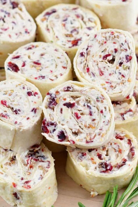 Cranberry Pecan Cream Cheese Pinwheels are so flavorful and festive, they will make a perfect appetizer for your holiday party! This is a fun pinwheels recipe packed with cream cheese, brie, dried cranberries, pecans, fresh rosemary, and a delightful hint of maple syrup. All of the flavors work perfectly together to bring the spirit of the holidays to your table. Fruit Pinwheels Cream Cheeses, Ruben Pinwheel Appetizers, Turkey And Cranberry Pinwheels, Cranberry Chicken Pinwheels, Cranberry Pinwheels Appetizers, Cranberry Hors D’oeuvres, Cranberry Tortilla Roll Ups, Sweet Pinwheel Recipes, Christmas Wraps Food