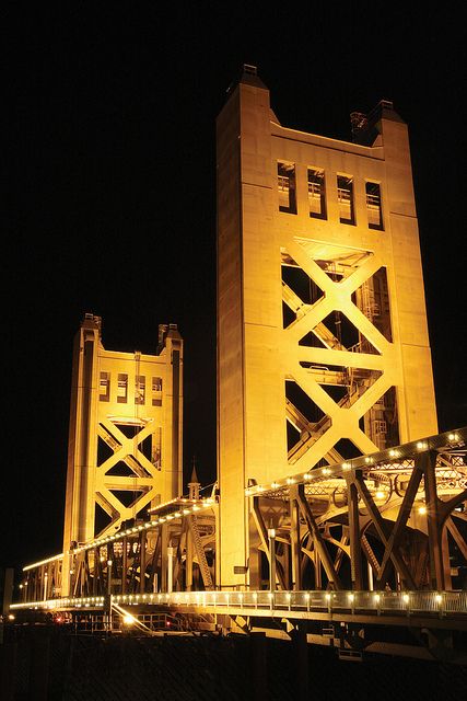 On December 22, 1933, the State of California, Sacramento County, and the Sacramento Northern Railway held a conference to plan a new bridge over the Sacramento River in case of war. The bridge style represents a rare use of Streamline Moderne architectural styling in a lift bridge, making it an outstanding expression of the social and architectural climate of the period of construction. The Tower Bridge was the first vertical lift bridge in the California Highway System. Sacramento Bridge, Sidney Australia, Sacramento River, Low Light Photography, Bridge Over Troubled Water, Streamline Moderne, Sacramento California, Innsbruck, A Bridge