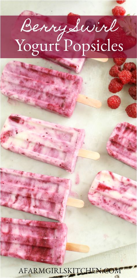 Creamy yogurt and fresh berries are swirled together to make hot summer days a bit cooler with these refreshing Berry Swirl Yogurt Popsicles. Homemade Popsicles are easy to make and delicious with fresh berries.  #yogurtpopsicles #popsicles #strawberrypopsicles #popsicles #yogurt #berries #homemade #recipe #summer Homemade Popsicles Healthy, Popcicles Recipes, Summer Popsicle Recipes, Yogurt Popsicle Recipes, Fruit Popsicle Recipes, Homemade Fruit Popsicles, Berry Popsicles, Healthy Popsicle Recipes, Berry Yogurt