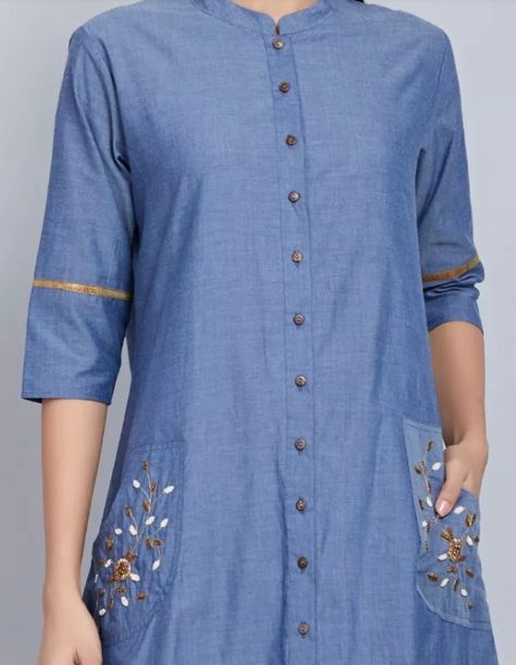 Beautiful detailing with embroidery and buttons Button Work On Kurti, Poket Kurti Work, Pocket Embroidery Kurti, Denim Kurti Designs Latest, Neck Patterns For Kurtis, Frock Style Kurti, Style For Short Women, Denim Kurti, Designs Kurti