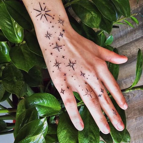 The stars have always held a special place in human history and imagination. From being used for navigation to inspiring countless myths and legends, ... Oh My Stars Tattoo, Hand Art Tattoo Ideas, Hand Tattoo Cute, Colorful Filler Tattoo, Star Pattern Tattoo Design, Stars Cute Drawing, Galaxy Hand Tattoos For Women, Star Tattoo Filler Ideas, How To Design Tattoo Sleeve