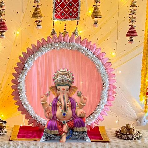 STUTI - Home Decor & Lifestyle ✨🧿 on Instagram: "DIY Ganpati Decor✨🌼त्योहार Series Part-5 Finally, this year’s Ganpati setup is here. I have used the same backdrop stand from my previous video and styled it differently. Material used : DIY Backdrop stand , 2 net cloth pieces, fairy light, hangings, bench, urlis, rangoli Mat , fresh flowers and a round lotus backdrop for Ganpati Idol. - Use 2 net cloth pieces in different color to create a gradient background effect. Tie them diagonally as sho Round Backdrop With Flowers, Round Backdrop Ideas, Ganpati Decoration At Home Background, Diy Ganpati, Diy Backdrop Stand, Cloth Pieces, Bandra Worli Sea Link, Ganpati Idol, Ganpati Decoration Theme