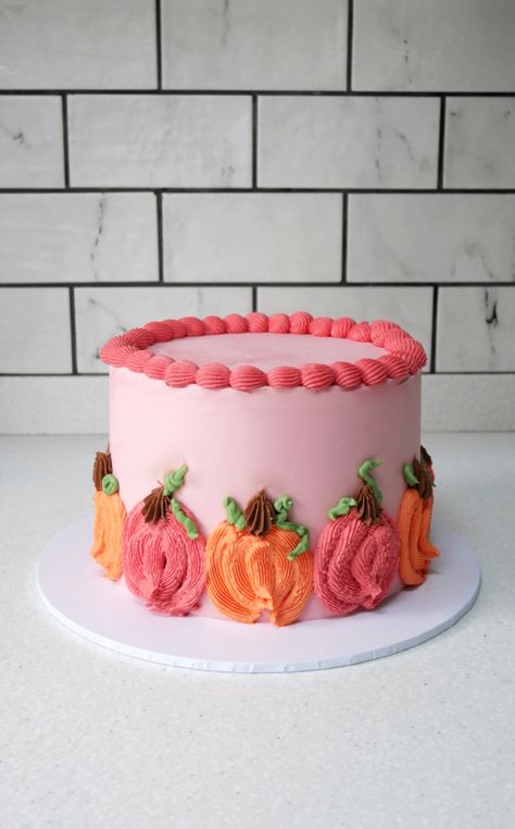 An autumnal birthday cake decorated with pink and orange buttercream pumpkins | Autumn birthday cake | Fall birthday cake | Green Kitchen Cakes | Bespoke Wedding and Celebration Cakes