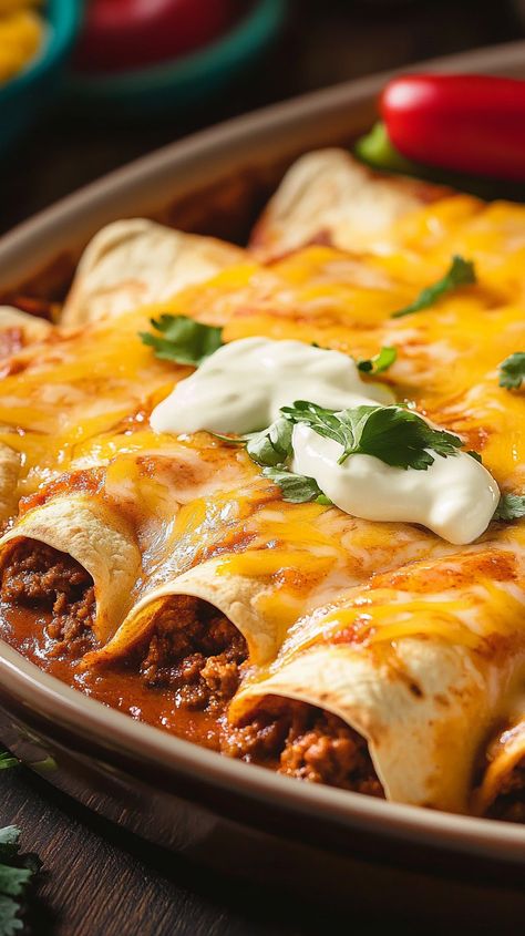 Spice up your dinner routine with these mouthwatering Ground Beef Enchiladas! Stuffed with seasoned beef, smothered in a rich, zesty sauce, and topped with melted cheese, this quick and delicious recipe is perfect for busy weeknights. Ideal for family dinners or entertaining guests, these enchiladas are sure to become a favorite in your household. Try this easy-to-make dish tonight and enjoy the flavorful fiesta! Crockpot Beef Enchiladas, Mexican Food Dinner Ideas, Enchiladas Ground Beef, September Dinners, Beef Enchiladas With Red Sauce, Cheese Enchilada Recipe, Beef And Cheese Enchiladas, Tacos Ground Beef, Mexican Ground Beef Recipes