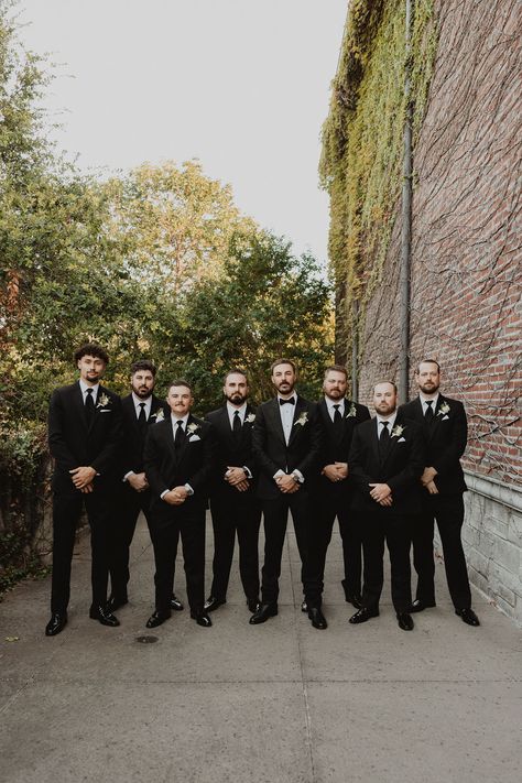 Sharp & Sophisticated: Groom and Groomsmen Wedding Style 🤵✨ Mens Black Suits Wedding, Groomsmen Tuxedo Wedding, Groomsman In Black, Black Outfit Groomsmen, Grooms Suits Wedding Black, Groom Bowtie Groomsmen Tie, Black Suits Groom, Groomsmen Black Tux With Tie, Wedding Suits Men Black Tuxedos Groom Attire Groomsmen