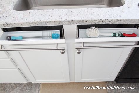 Turn those fake drawer panels that serve very little purpose directly under your sink into hidden storage. Kitchen Sink Organization Sponge, Under Kitchen Sink, Kitchen Sink Cabinet, Best Kitchen Sinks, Kitchen Sink Organization, Kitchen Sink Storage, Hidden Kitchen, Under Sink Organization, Sink Storage