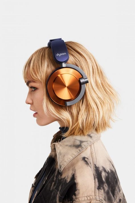 The headphones have a component-led aesthetic. Grill Dessert, Thick Headbands, Industrial Design Trends, Bladeless Fan, Headphones Design, Sound Machine, Noise Cancelling Headphones, Active Noise Cancellation, Hearing Aids