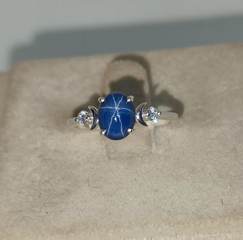 Excited to share the latest addition to my #etsy shop: Moon Blue Star Sapphire Ring, Star Gemstone, Lindy Star Ring, 925 Sterling Silver, 6×8mm Oval Cabochon Gemstone, Gift for Her https://etsy.me/41UD4VJ #silver #ethicalgemstones #emerald #cathedral #threestone #artde Star Sapphire Stone, Blue Star Sapphire Ring, Promise Rings Simple, Peridot Engagement Rings, Star Sapphire Ring, Garnet Engagement Ring, Red Garnet Ring, Moon Blue, Blue Star Sapphire