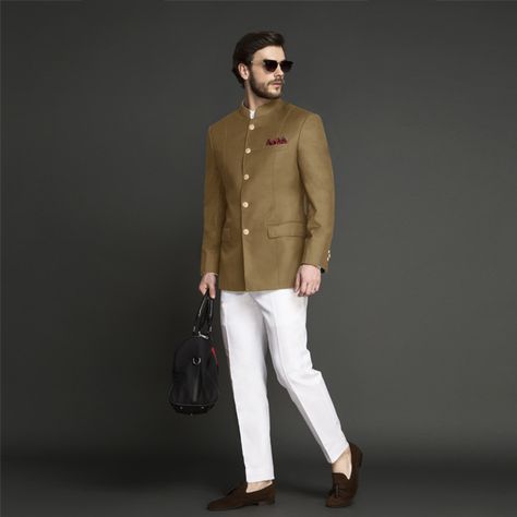 This Jodhpuri Suit is every bit young and smart and is darted to give a well-tailored fit. The coat is tailored from Super 120s Italian wool and paired with white pants made out of Italian milled long staple cotton fabric. The suit has luxurious hand painted buttons from Jaipur. #indianwedding #jodhpurisuitwedding  #indiangroomattire #bandhgalasuit #indiangroom #desiwedding #menscustomsuit #affordableluxury #instawedding #indianweddinginspiration # Mens Wedding Wear Indian, Jaipuri Suits, Prince Suit, Jodhpuri Suits, Custom Suits Men, Mens Indian Wear, Wedding Kurta For Men, Groom Dress Men, Italian Fabrics