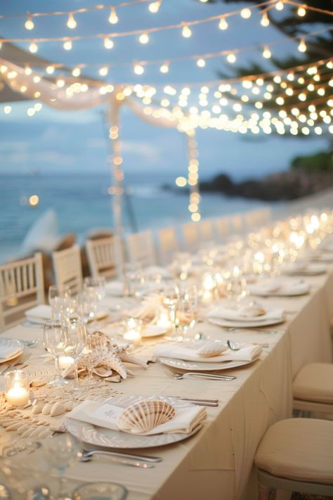 Beach wedding reception. Long, cream-colored tables with sea-shell centerpieces under twinkling fairy lights.

Stunning ocean vistas, breezy cliffside beauty, the nautical charm of seashore treasures; coastal weddings have a magical allure of their own. If you're planning on saying 'I do' amidst the intoxicating salt-kissed air, then these 25 coastal wedding reception décor ideas are definitely a wave worth riding. From mesmerizing marine-inspired…

Read more: https://tastywed.com/25-coastal-wedding-reception-decor/ Beach Fairy Lights Wedding, Beach Table Setting Wedding, Beach Dinner Table Decor, Beach Wedding Table Set Up, Beach Wedding Celebration, Wedding Decorations Beach Theme, Elegant Nautical Party Decor, Under The Sea Theme Wedding, Bridal Shower On The Beach