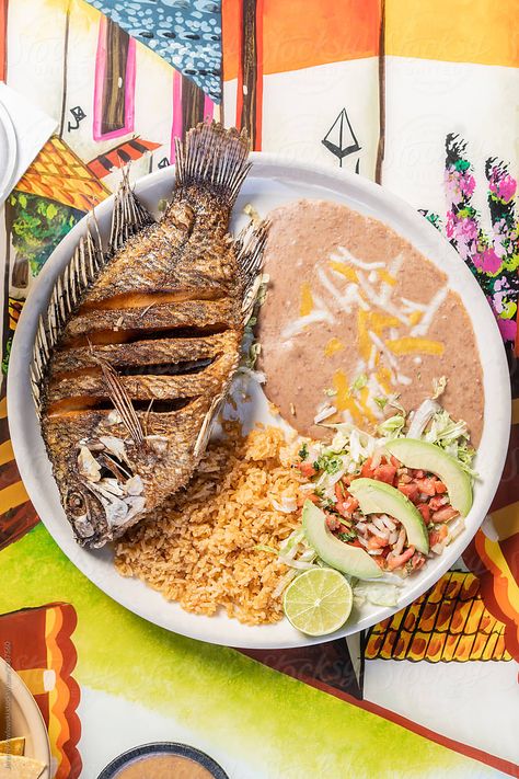 Mexican Fried Fish by Jeremy Pawlowski for Stocksy United Mexican Fried Fish, Fried Fish Talapia, Fish Fry Photos, Mexican Fish Recipes, Fish Tacos Photography, Fried Fish Plate, Fried Whole Fish, Mexican Fish, Fish Tacos Tilapia