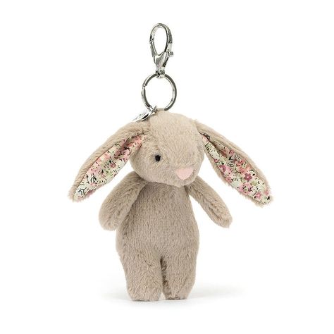 Put a hop in your step wherever you go with the Blossom Beige Bunny Bag Charm! This bouncing charm is beautifully soft, with praline fur, a fluffy cream bobtail and ditsy-print ears in blush, white and moss. With a silver chain, claw clip and Jellycat tag, this bunny makes any bag bonny. Recommended Age: Recommended for 3 years + due to small parts. Care Instructions: Hand wash only; do not tumble dry, dry clean or iron. Not recommended to clean in a washing machine. Dimensions: H17 X W4 CM Cher Matching Things, Personalised Jumpers, Pretty Products, Jellycat Bunny, Summer Wishlist, Bunny Bags, Personalized Bunny, Ditsy Print, Beige Bag