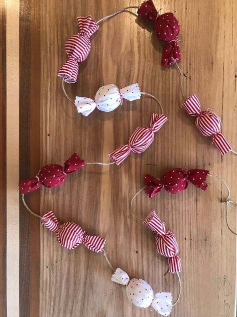 A sweet addition to your holiday decor! This garland consists of wrapped 'candies' in red and white fabrics- both striped and polka dotted. Use to decorate your mantle, Christmas tree, and more! Size- individual 'candies' are about 4 inches long.  *6 foot garland consists of 10 candies  *9 foot garland consists of 16 candies -Each garland is hand crafted with love; meaning that each one is completely unique and may vary slightly. Candy Garland, Love Meaning, Mantle Christmas, Fabric Christmas Decorations, Candy Decorations, Holiday Garlands, Christmas Tree Garland, Christmas Inspo, Diy Garland