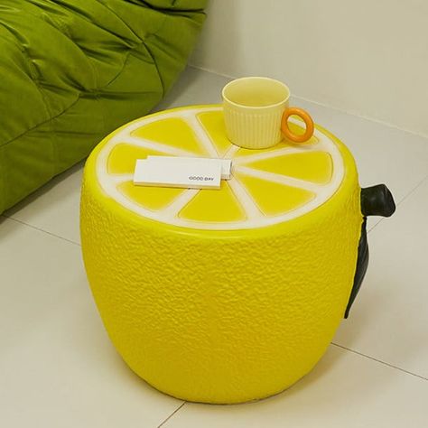 Brighten up your home decor with our Lemon Shaped Side Table. This unique piece of furniture adds a fun and vibrant touch to any living room or bedroom. Crafted from high-quality materials, it ensures both durability and style. Perfect as a bedside table or an accent piece in your living room, this side table combines functionality with a playful design. Enhance your interior design with this eye-catching, modern table that brings a splash of color and creativity to your space. Specifications Ma Fruit Themed Living Room, Fun Interior Design Creative, Creative Side Tables, Dopamine Furniture, Colorful Side Table, Lemon Room, Lemon Home Decor, Playful Furniture, Funny Furniture