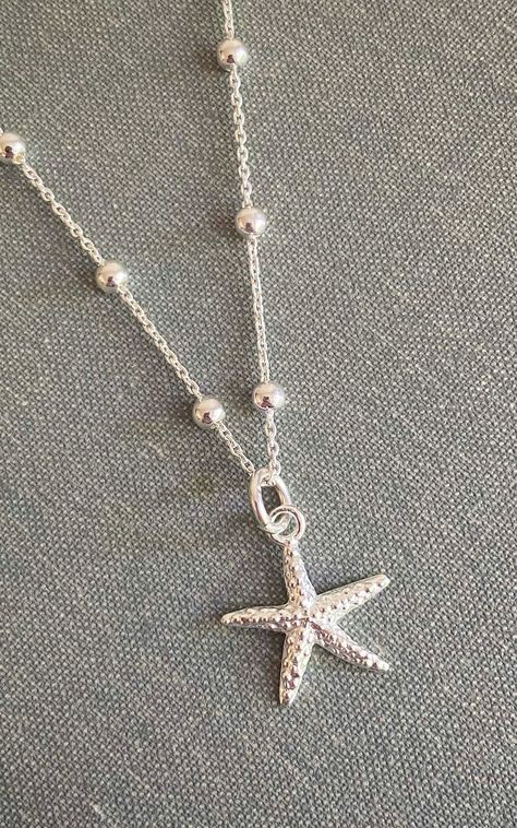 Carry a little bit of the ocean with you no matter where you go with our pretty sterling silver starfish necklace. A stunning everyday piece, this pretty necklace is perfect worn on its own or layered with other necklaces to create your own unique look. We think its styles best with beach wave hair, sun kissed skin and a cocktail (or mocktail) in hand!!    the bobble chain is a perfect alternative to the classic cable chain seen on many necklaces today. This sterling silver chain has tiny spheri Silver Beach Jewelry, Layered Silver Necklaces, Sun Kissed Skin, Beach Wave Hair, Pretty Jewelry Necklaces, Beach Wave, Pretty Necklace, Starfish Necklace, Ocean Jewelry