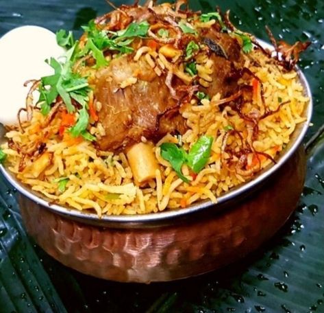 Hyderabadi mutton biryani is a classic dish made by layering rice over slow cooked mutton gravy. Mutton is more often going to be slow cooked, because it tends to be tougher. Marinating for periods of time can also help give mutton a more tender profile. Both methods of cooking are delicious in their own ways. Many historians believe that biryani originated from Persia and was brought to India by the Mughals. Biryani was further developed in the Mughal royal kitchen. Mutton Biryani Photography, Saag Gosht, Mutton Biriyani, Methods Of Cooking, Mutton Korma, Mutton Gravy, Mutton Biryani, Royal Kitchen, Mutton Recipes