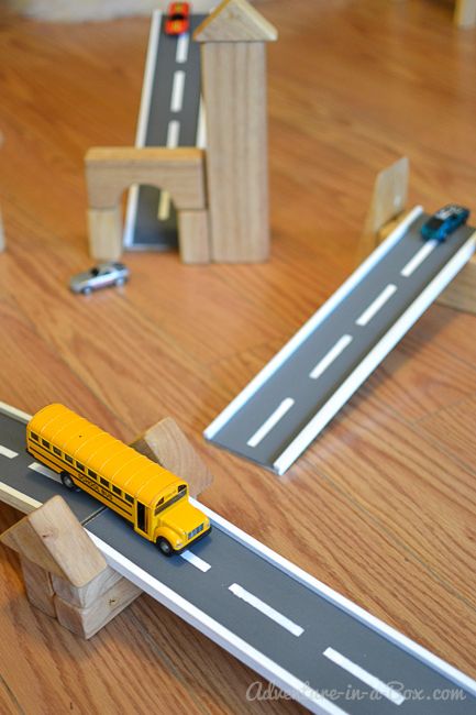 DIY Wooden Road Tracks and Ramps: how to make a simple set of wooden road tracks and ramps for hours of entertainment Wooden Car Ramps Diy, Vehicle Activities, Diy Car Ramps, Car Tracks For Kids, Toy Road, Sports Nursery, Car Ramps, Cardboard Toys, Homemade Toys