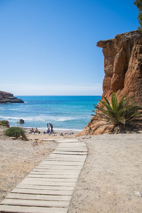 On the south coast of Ibiza, the beach of Sa Caleta remains somewhat of a hidden gem and feels like stepping back in time. It’s famed for its narrow strip of deep, reddish sand, water so clear you could be in the Caribbean and the rich clay you can scrape from the Cliffside to use as a face or body mask.   #ibizabay #nobuhotelibizabay #ibiza Nobu Hotel, Ibiza Formentera, Hotel Ibiza, Ibiza Travel, Ibiza Beach, Body Mask, Ibiza Spain, Celebrity Travel, European Summer