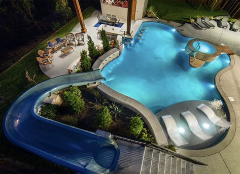 Swimming pool with a slide idea for the backyard. | 11 of the Best Backyard Swimming Pools We've Ever Seen Swimming Pool Slides, Dream Backyard Pool, Relaxation Station, Big Pools, Big Backyard, Swim Up Bar, Splash Pool, Dream Pools, Custom Pools