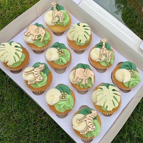 Jungle themed cupcakes farm animals fondant green buttercream piping young wild and three banana leafs giraffe zebra elephant gold glitter cricut sprinkles colour mill Wild 1 Cupcakes, Wild One Birthday Party Treats, Pink Safari Cupcakes, Cupcake Jungle Theme, Jungle Safari Cupcakes, Wild One Cupcakes Boy, Two Wild Birthday Cupcakes, Party Animal Cupcakes, Jungle Animal Cupcakes