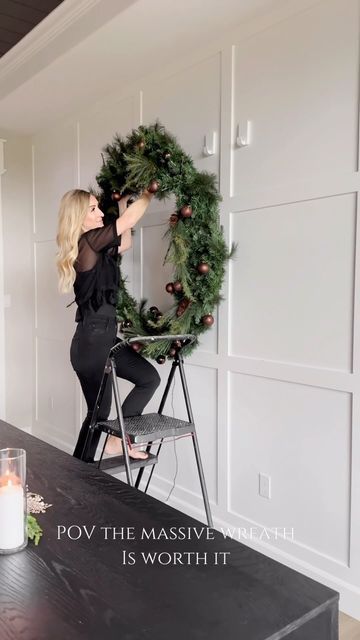 Jordyn Smith on Instagram: "POV you hang the massive wreath from your basement and it's so worth it! Comment SHOP for links to this space. I've been staring at this wreath now for a couple weeks wondering if it will make an appearance from the basement storage room. And then it clicked where it needed to go... How to shop me home/ Click link in my BIO or comment SHOP for links to similar large wreaths! Wreath Holiday decor Dining room Go big Holiday season Home decor" Large Wreath Outdoor Christmas Decor, Diy Big Wreath, Big Christmas Wreath, Large Wreath Over Fireplace, Hanging Wreath On Door, Large Outdoor Wreath On House, Diy Giant Wreath, Large Wreath Outdoor, Huge Christmas Wreath