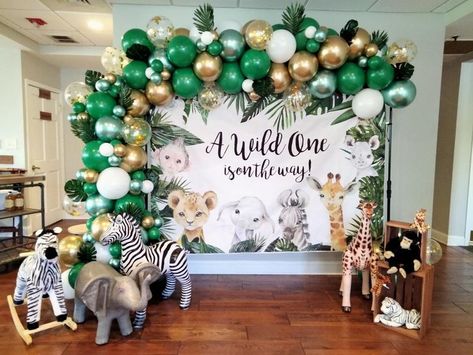 This a wild one is on the way backdrop is perfct for your jungle theme baby shower. Jungle themed baby showers and parties are super popular right now and I don't think they will go out of style any time soon. This was the first jungle theme set up I did. This backdrop could be used as a selfie station, or for the expecting mom to open gifts infront of. For this set up, it was used for both! Balloons Arch, Baby Shower Background, Baby Shower Safari Theme, Jungle Theme Birthday, Jungle Baby Shower Theme, Gold Confetti Balloons, Shower Backdrop, Diy Balloon, Garland Arch