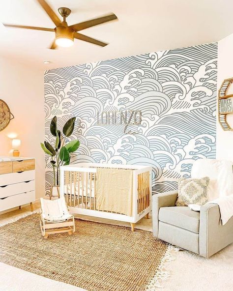 22 Calming Coastal Nursery Decorating Ideas » Lady Decluttered Nursery Ideas Ocean Sea Theme, Baby Boy Nursery Wave Wallpaper, Waves Nursery Wall, Waves Wallpaper Nursery, Ocean Wave Nursery, Surf Nursery Decor, Modern Ocean Themed Nursery, Waves Nursery Theme, Water Themed Nursery Ideas