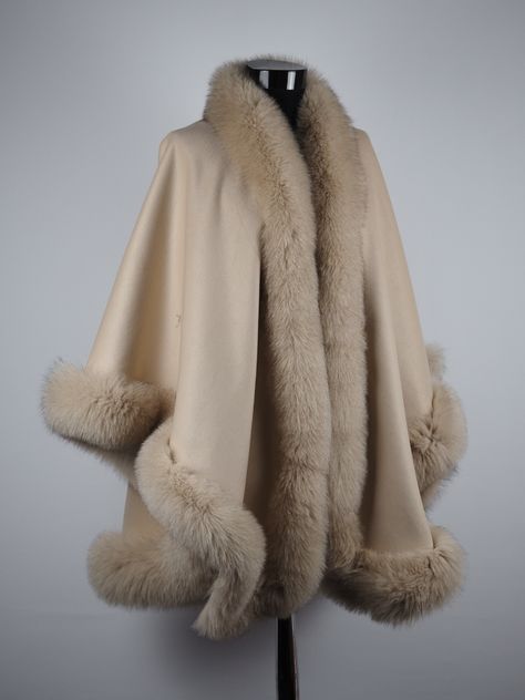 * Designed to keep you warm & feeling cozy! This beautiful cape is made with Cashmere and authentic dyed Fox Fur Trim. Elegant yet practical - this cashmere cape with genuine fox fur trim is the perfect finishing touch to every part of your wardrobe. Wear it every day layered over your daily outerwear, as a cape over pants or as a wrap over your fanciest evening wear! Fantastic quality and an superb value. * One size fits all. * Condition: Brand New * Material: Cashmere Fabric * Fur Origin: Finl Formal Wrap, Fur Trimmed Cape, Winter Cape, Cape For Women, Cashmere Cape, Fur Cape, Fur Wrap, Cashmere Fabric, Capes For Women